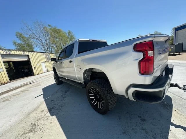 Silver Silverado rear three-quarter view